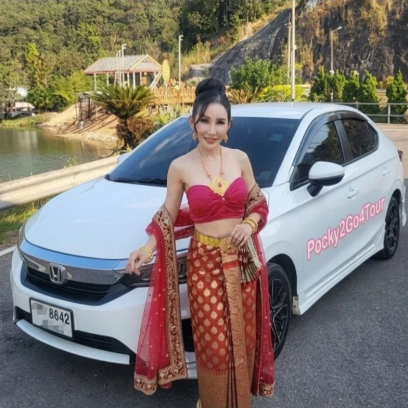 Pocky beside her Pocky2Go4Tour car